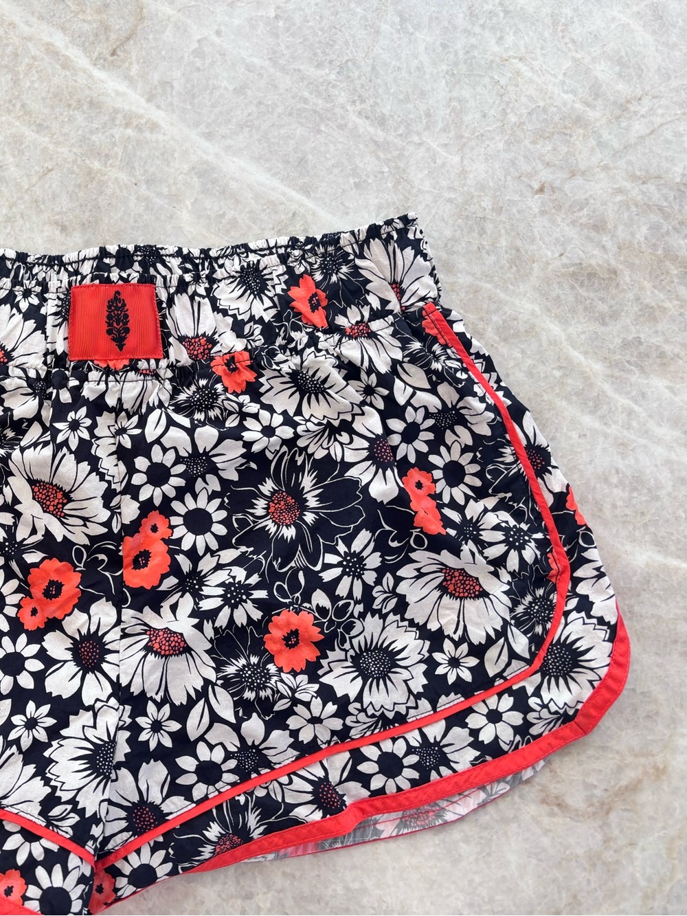 FP Movement by Free People black Floral Athletic Shorts with Coral Accents